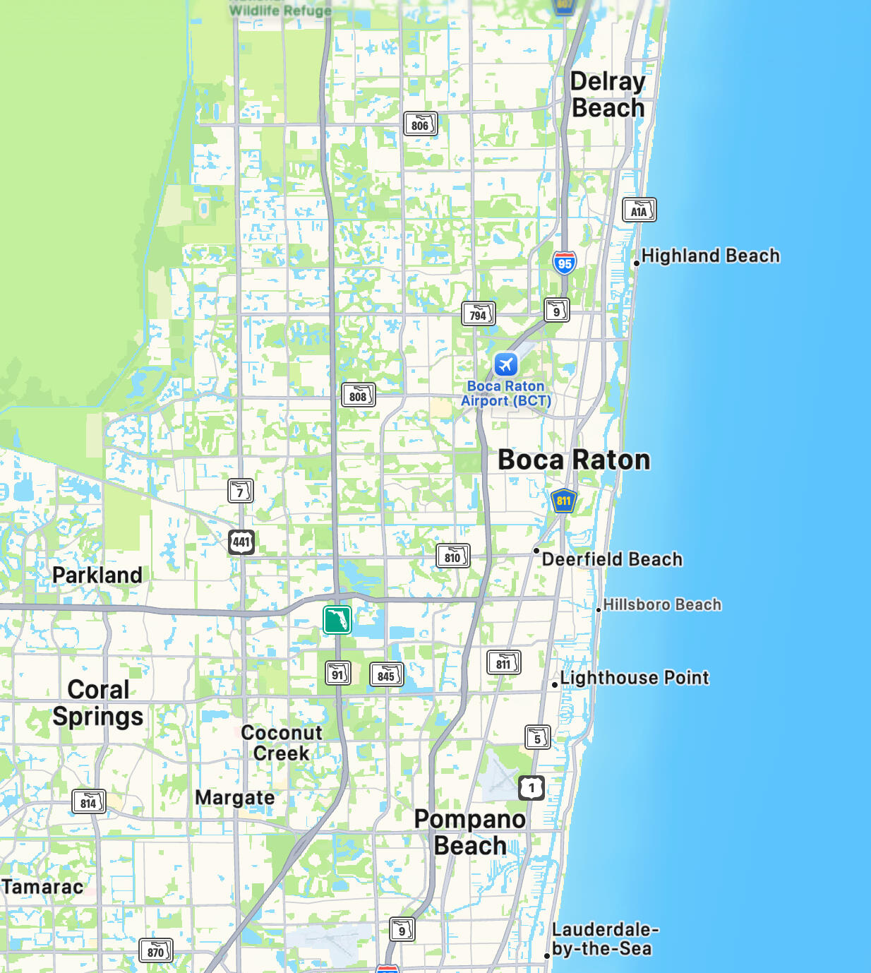 Minimalist luxury emblem with gold pillars, letter B and laurel wreath symbolizing Boca Raton master craftsmanship and quality